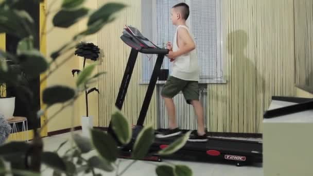 Young Guy Goes Sports Treadmill Home — Stockvideo