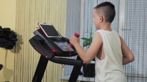 Young Man Goes Sports Treadmill Home — Stockvideo