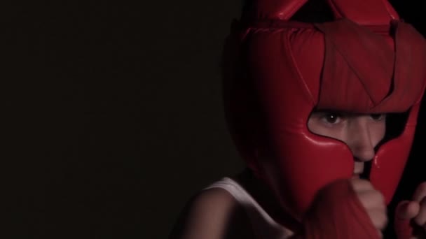 Young Guy Boxer Practices Punches Dark Room Boxing Protective Helmet — Videoclip de stoc