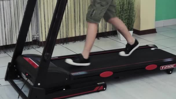Young Guy Goes Sports Treadmill Home — Vídeos de Stock