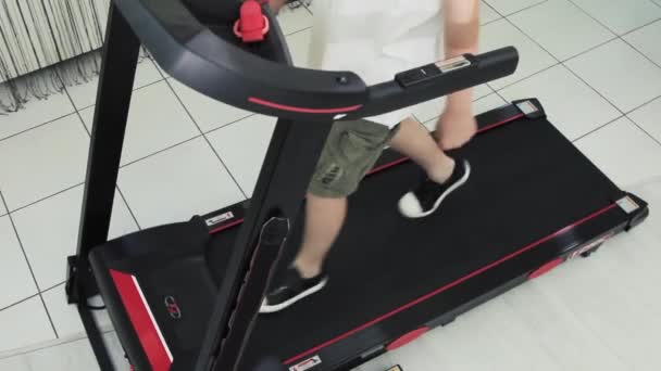 Guy Goes Sports Home Treadmill Top View His Feet — Vídeo de Stock