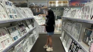 Beautiful brunette girl photo frame in the supermarket