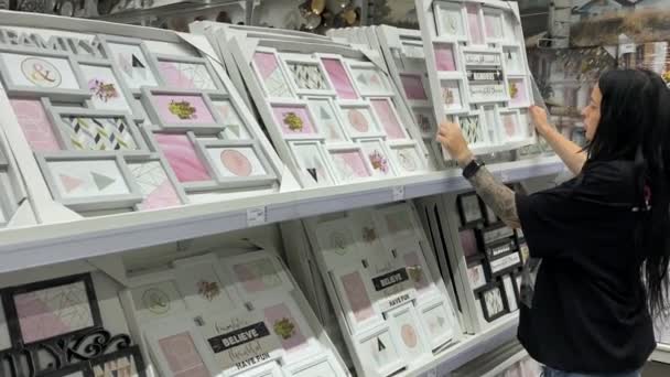 Woman Gift Shop Examines Beautiful Photo Frames Home — Vídeos de Stock
