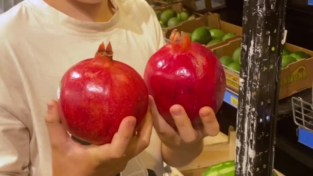 Young Guy Holding Fresh Big Red Pomegranate Fruit His Hands — Stockvideo