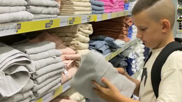Young Man Fabric Store Chooses Towel Bathroom Apartment — Vídeos de Stock