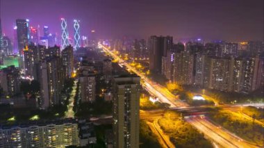 Urban timelapse of China city with traffic of cars and beautiful skyscrapers with business centers. City center in Asia traffic cars on the street
