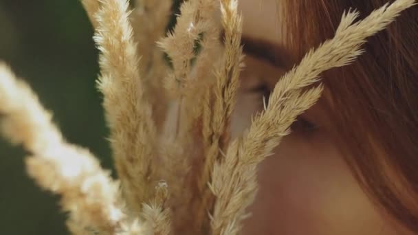 Close Portrait Attractive Woman Closed Eyes Bouquet Spikelets Her Hands — Stockvideo