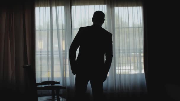 Silhouette Man Walking Dark Room Window Guy Classic Suit Sit — Vídeo de stock