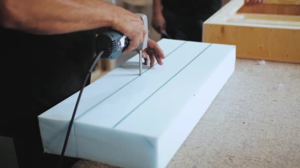 Close Hand Male Worker Cutting Foam Rubber Production Sofa Furniture — 图库视频影像