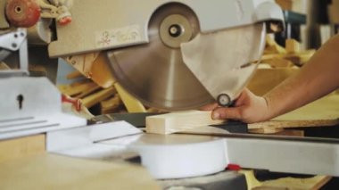 Furniture production. Woodworking concept. Cutting wood with CNC milling machines. Production process in furniture factory, woodworking machine mechanism, close up. Workflow in furniture factory.4k