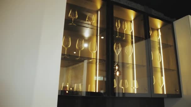 Black Cupboard Glass Wall Kitchen Crockery Clear Glasses Lighting Clean — Stockvideo