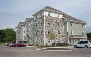 Contemporary Black and Gray Peppered Brick Apartment Building