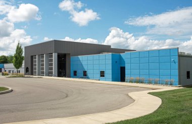 Contemporary Blue and Gray Business Building with Curved Drive 