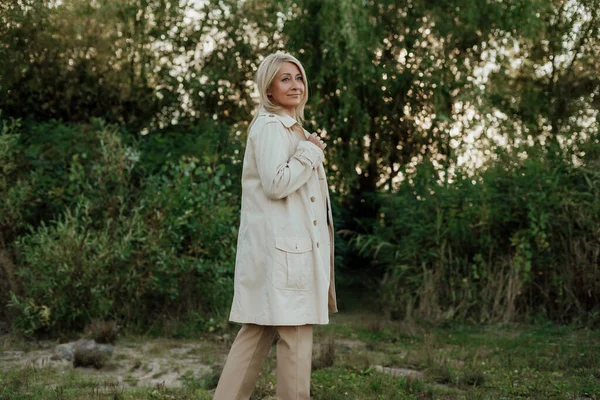 Beautiful Adult Woman Blond Hair Dressed Light Raincoat Stands Still — Stock Photo, Image