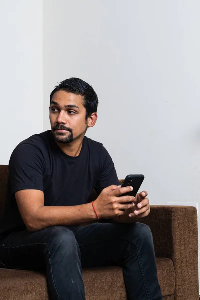 Young Teenage Boy Using Mobile Phone While Sitting Sofa Looking — Stock Photo, Image