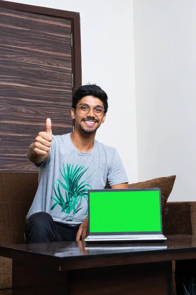Young Indian Boy Laptop Green Screen Showing Thumbs Camera While — Stock Photo, Image
