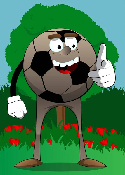 サッカーボールは彼の手で視聴者を指しています 顔を持つ漫画のキャラクターとしての伝統的なサッカーボール — ストックベクタ