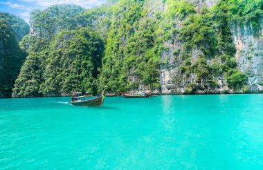 Long Tail Boats at pileh bay in Krabi, Thailand. Wonderful turqoise sea at andaman sea.