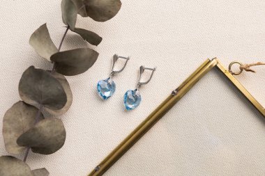 Handmade jewelry on a textile background. Gift for women. Bijouterie and jewellery for women