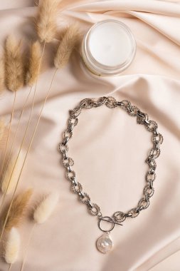 Handmade jewelry on a textile background. Gift for women. Bijouterie and jewellery for women