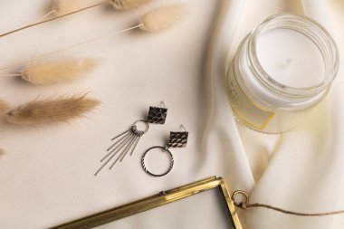 Handmade jewelry on a textile background. Gift for women. Bijouterie and jewellery for women