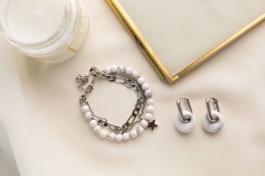 Handmade jewelry on a textile background. Gift for women. Bijouterie and jewellery for women