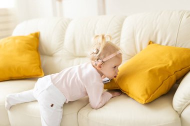 Cochlear implant for baby. Deaf child with hearing aid at home