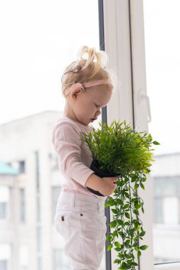 Cochlear implant for baby. Deaf child with hearing aid. Health care and medicine technology and innovations