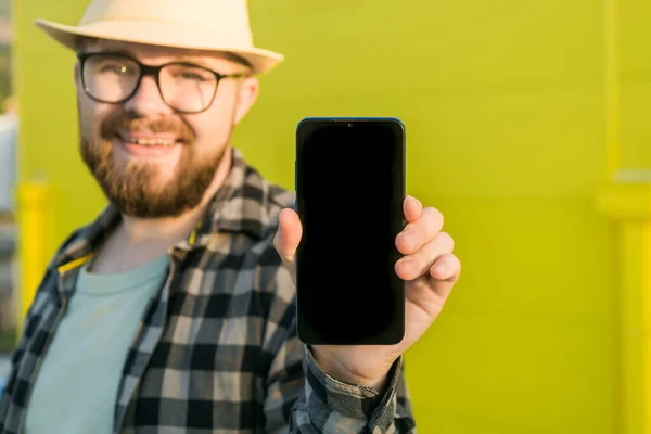 Hot Offering Happy Guy Holds Cellphone Black Copy Space Smiling — Foto de Stock