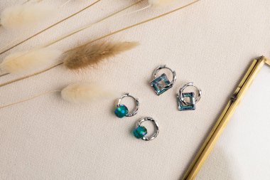 Handmade jewelry on a textile background. Gift for women. Bijouterie and jewellery for a women