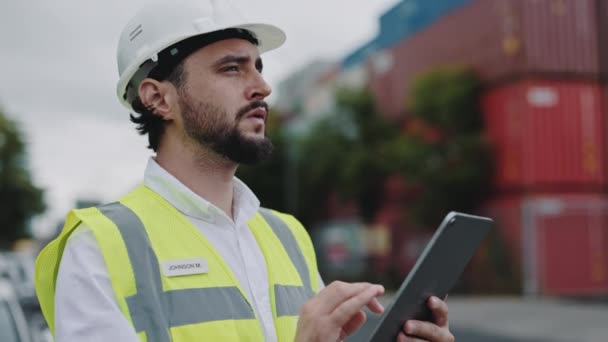 Focused man using tablet for work at warehouse harbor — Vídeo de Stock