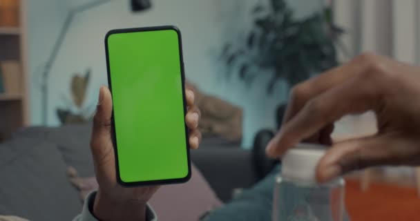 Sick man having video call on mobile with green screen — Stockvideo