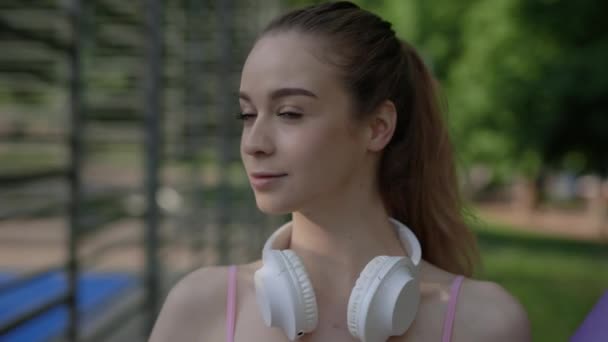 Portrait Yoga Woman Wearing Headphones Her Neck Looking Camera Sport — 비디오