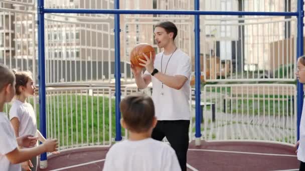 School Coach Mentoring Kids How Catch Throw Ball Basketball Court — Wideo stockowe