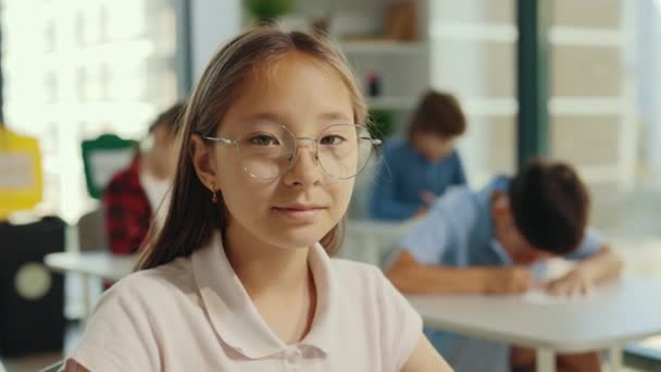 Portrait Asian Female Pupil Wearing Glasses Looking Camera Sitting Chair — Video Stock