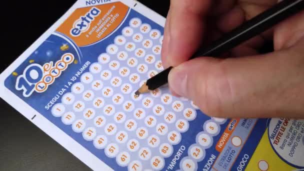 Rome Italy August 2022 Man Slashes Numbers Lottery Ticket Hand — ストック動画