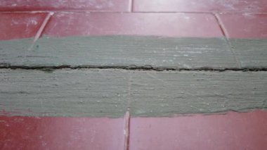 Outdoor tiles with a layer of green insulating paint. High quality 4k footage