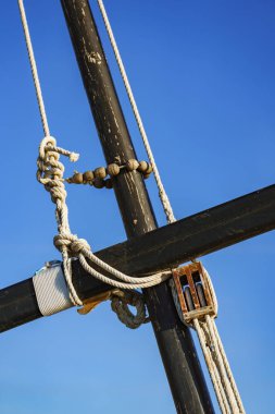 Close-up of lateen rigging sailing boat. Part of a traditional sailing boat made of wood in Puerto de Catarroja, Valencia, Spain