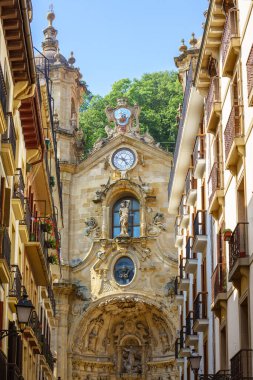 Saint Mary basilica in San Sebastian Donostia, Historic 18th-century Catholic church with ornately carved exterior doors