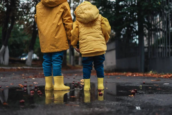Children Yellow Rubber Boots Autumn Jackets Jumping Puddle Autumn Mood — Zdjęcie stockowe