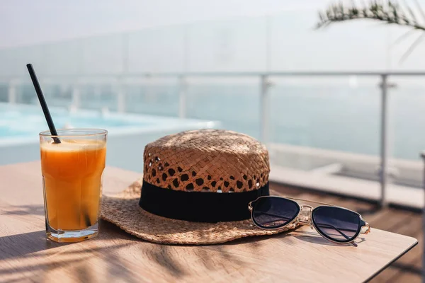 Orange Juice Straw Hat Glasses Cafe Background Sea — Stockfoto