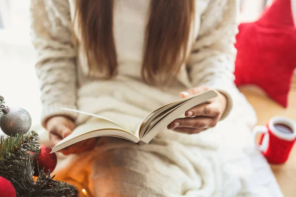 Girl reading a book, new year mood.