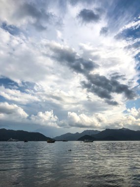 Beautiful sea view, sailboats far away in the sea in sunny day, natural background, amazing summer adventure.