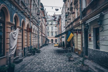Traditional buildings in a cobblestone street in historical Old town of Lviv.