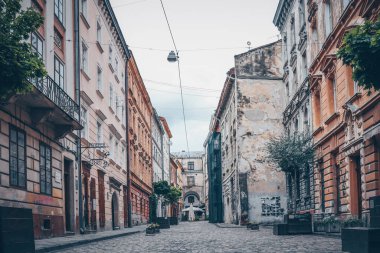 Traditional buildings in a cobblestone street in historical Old town of Lviv.