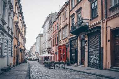 Traditional buildings in a cobblestone street in historical Old town of Lviv.