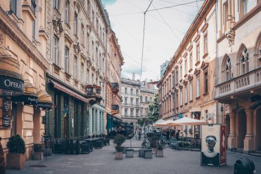 Traditional buildings in a cobblestone street in historical Old town of Lviv.