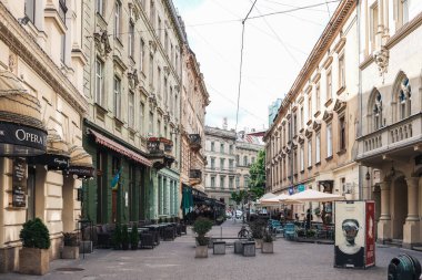 Traditional buildings in a cobblestone street in historical Old town of Lviv.