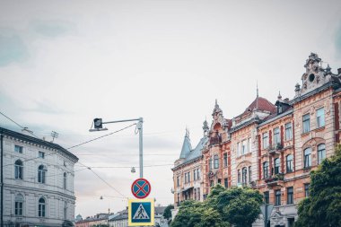 Facades of houses in Lviv, old buildings against the sky
