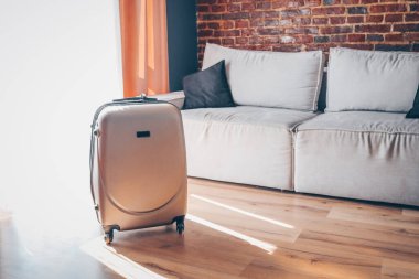 Suitcase in a bright modern apartment